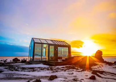 Blár, Hella, a glass house in Iceland with a hot tub and the northern lights as a roof.