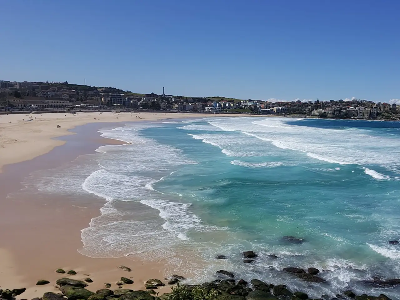 Bondi Beach, Sydney - One of the most well-known beaches in the world may be found there thanks to the combination of tanned bodies, blonde sand, backpackers, and surf.