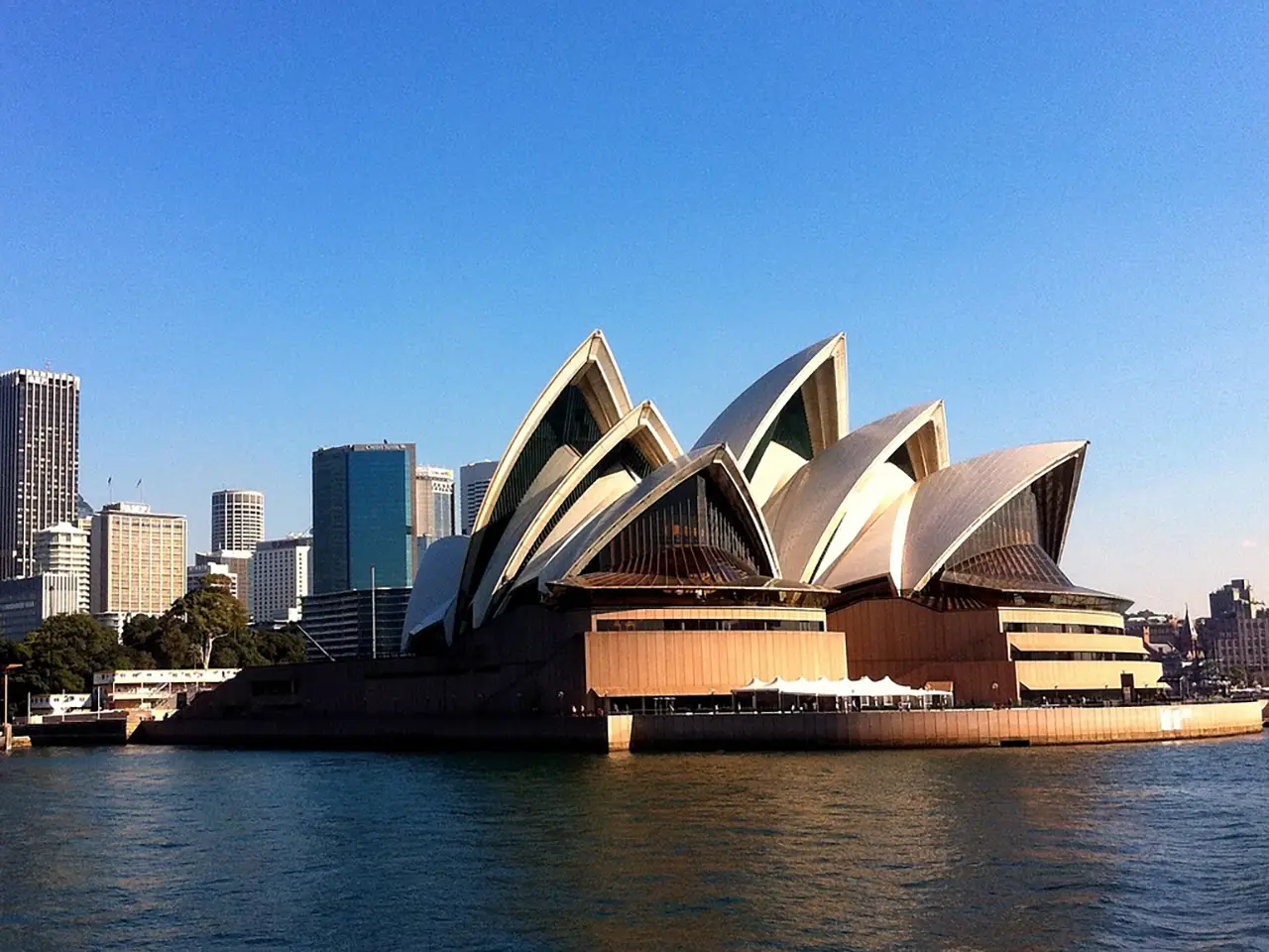 Sydney Opera House. Board a harbor cruise or ferry and take pictures while you travel by. the Opera House.