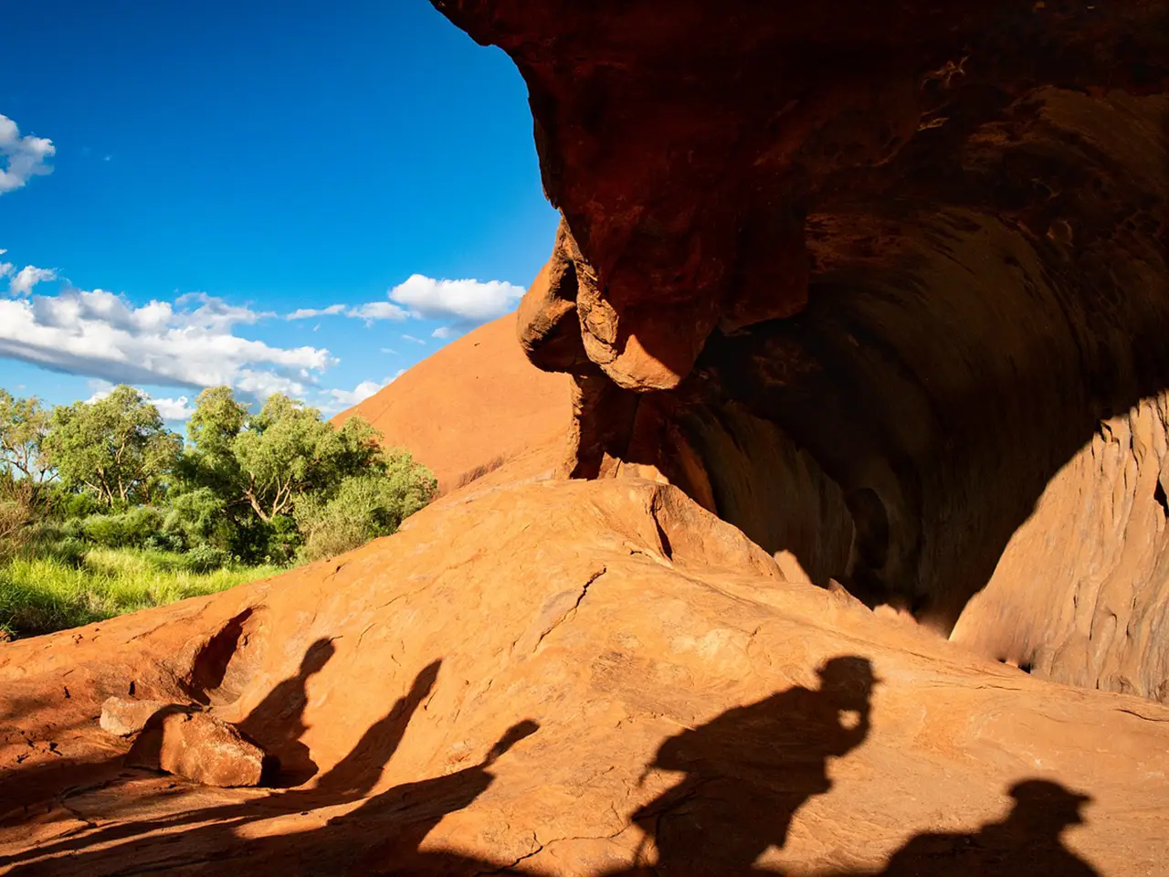 The Uluru, which in local Aboriginal tongue means "shadowy place," rises 348 meters above the plain below.