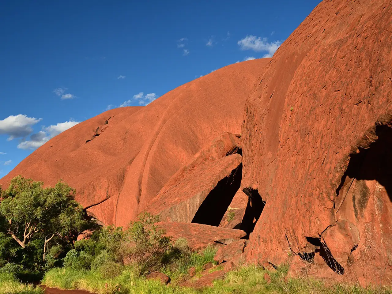 The Uluru, which in local Aboriginal tongue means "shadowy place," rises 348 meters above the plain below.